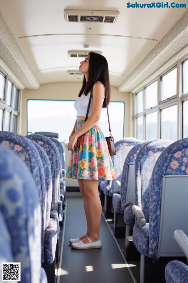 A woman standing in the middle of a train.